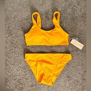 Brand new mustard 2 piece swim suit